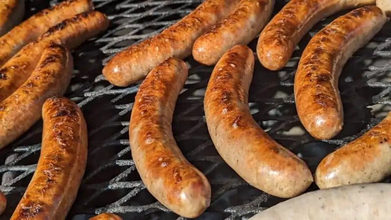 Brats Cooking on a Grill
