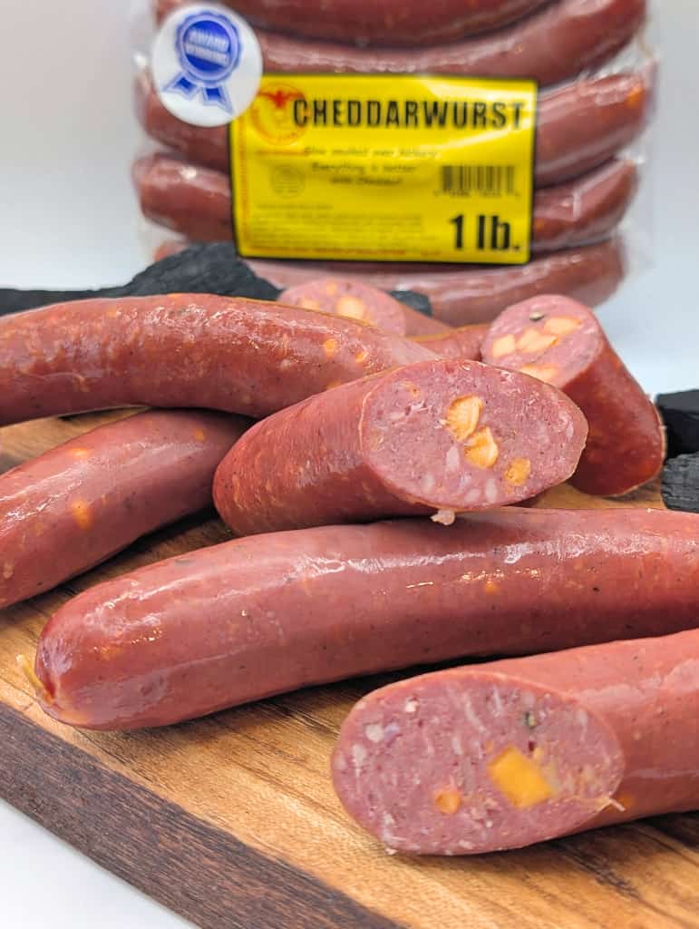 Smoked cheddarwurst retail display from Wisconsin River Meats, smoked sausage with Wisconsin cheddar