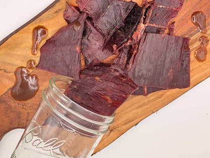 Retail beef jerky display featuring teriyaki flavored jerky made in Wisconsin